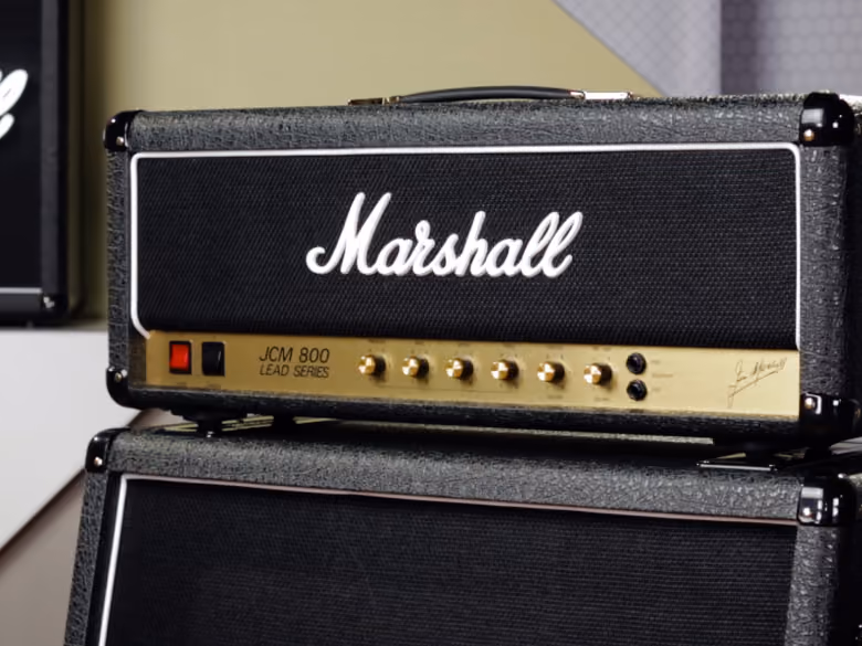 A tube-powered overdrive pedal with its drive knobs and a visibly glowing vacuum tube, the gain stage that pushes a signal past its headroom.