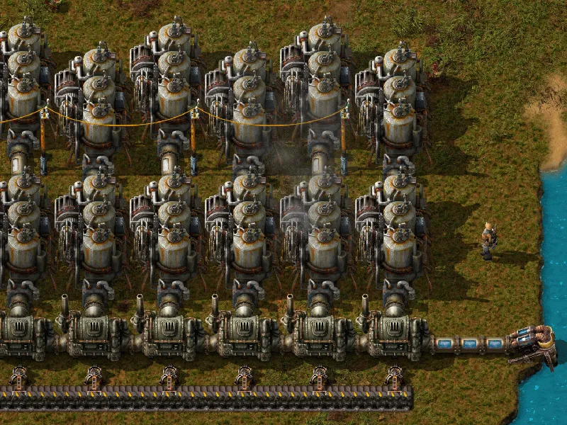 An offshore pump piped into rows of boilers, each pair of boilers piped into steam engines, all connected to power poles