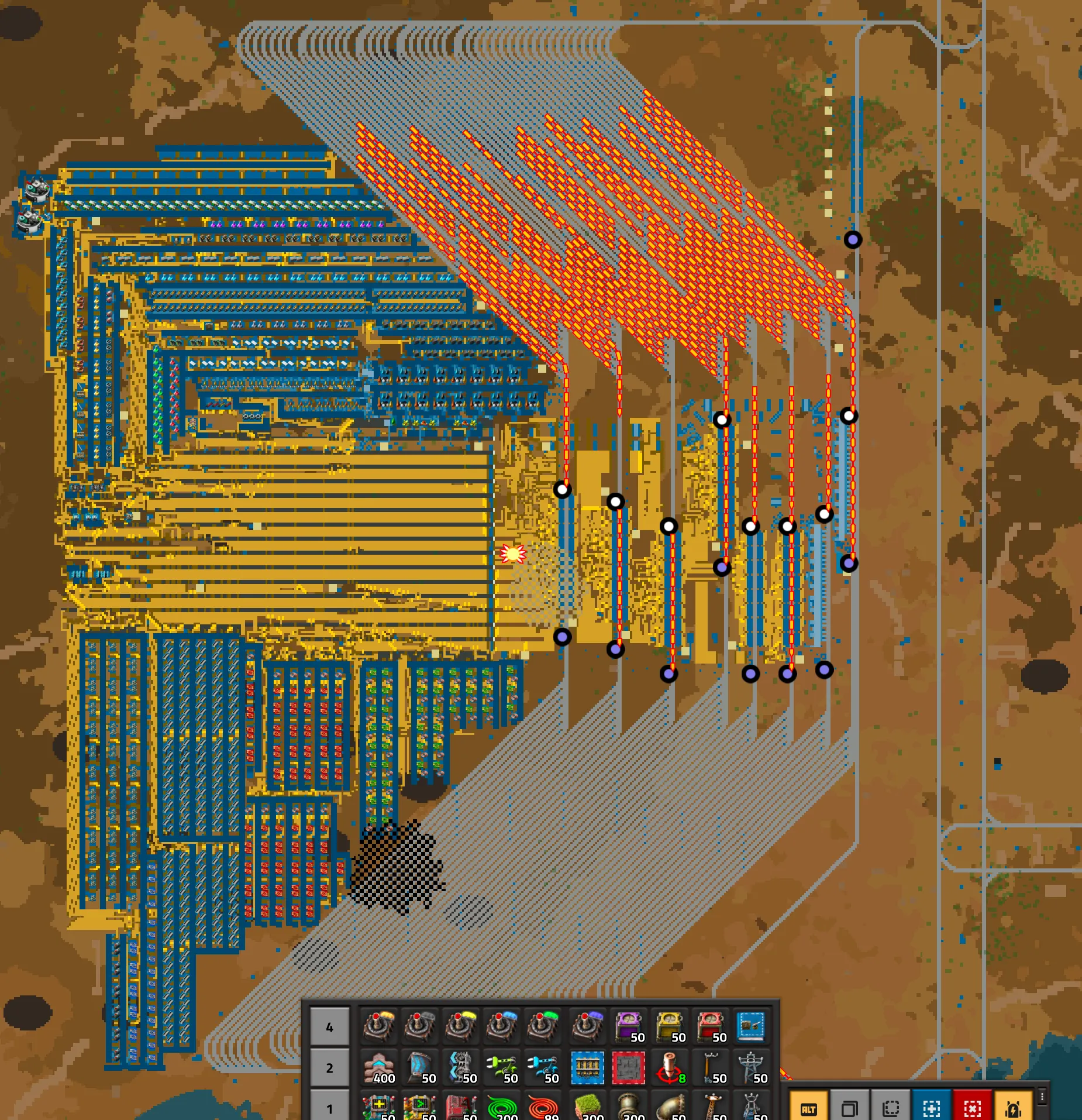 A wiki screenshot of a megabase's production hub, dozens of parallel bus belts running along its edge before fanning out into multiple rail lines heading toward distant outposts