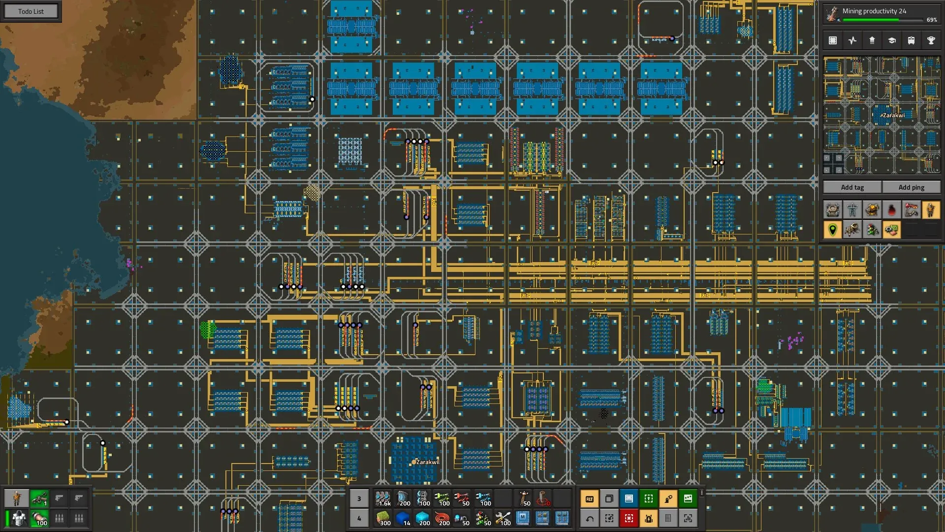 A wiki screenshot of a megabase built from many identical, grid-aligned production blocks connected by a shared rail network
