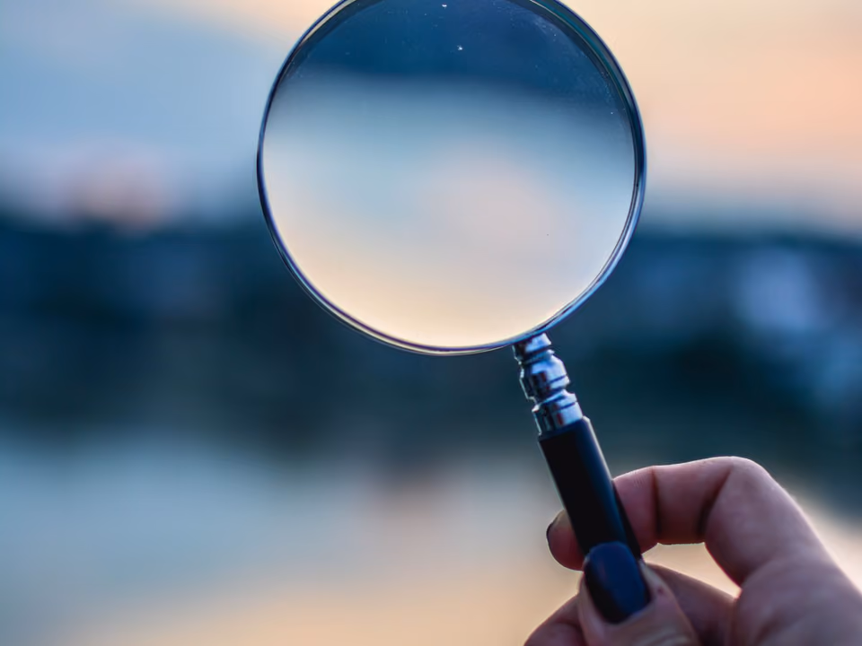 A magnifying glass held in selective focus