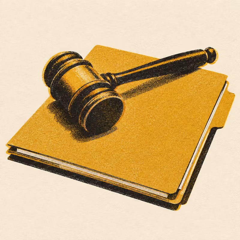 A gavel resting on a closed case file