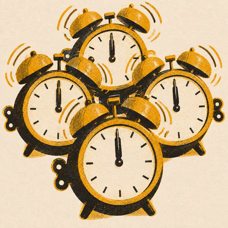 A tight cluster of identical alarm clocks, all their hands at the same hour, ringing together