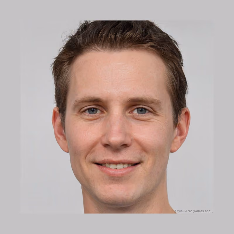 A machine-generated portrait. A person with short light brown hair, faintly smiling, facing the camera against a plain white background