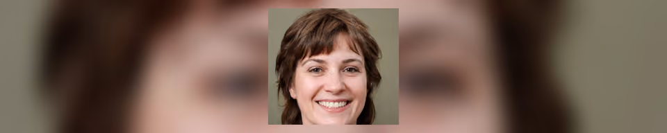 A photographic portrait of a woman with shoulder-length brown hair and a fringe, smiling and facing the viewer against a plain olive background.