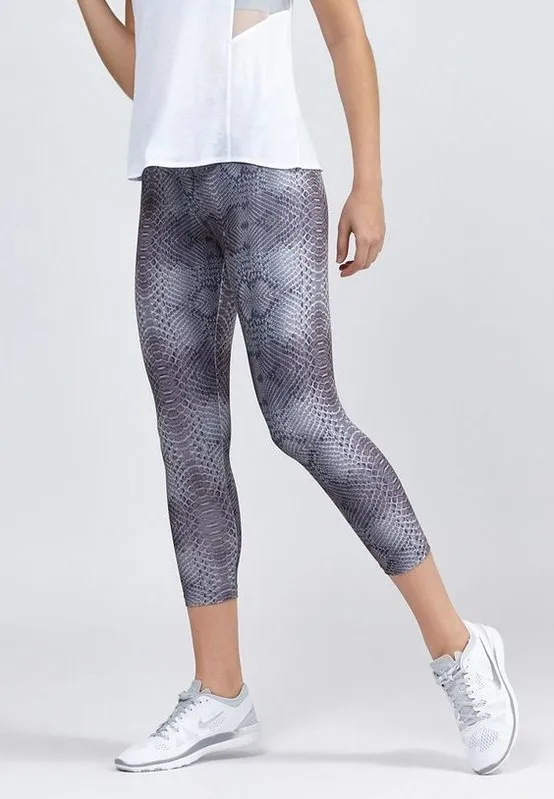 Gym kit outfit: a tank top, patterned leggings, and trainers