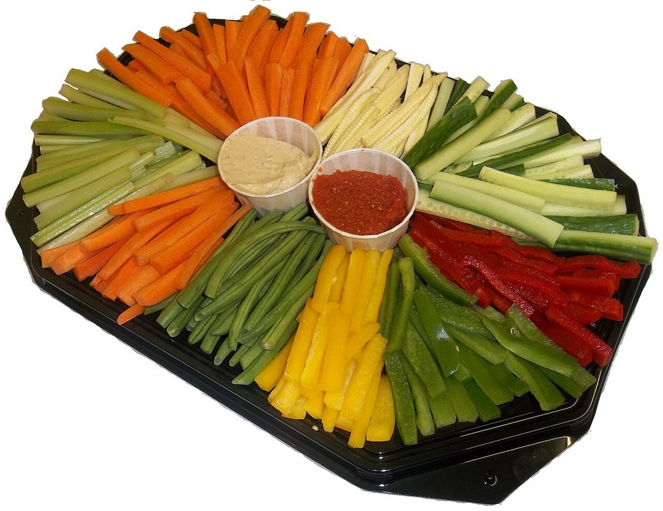 A crudités platter of vegetable batons around two dips, carrot among them