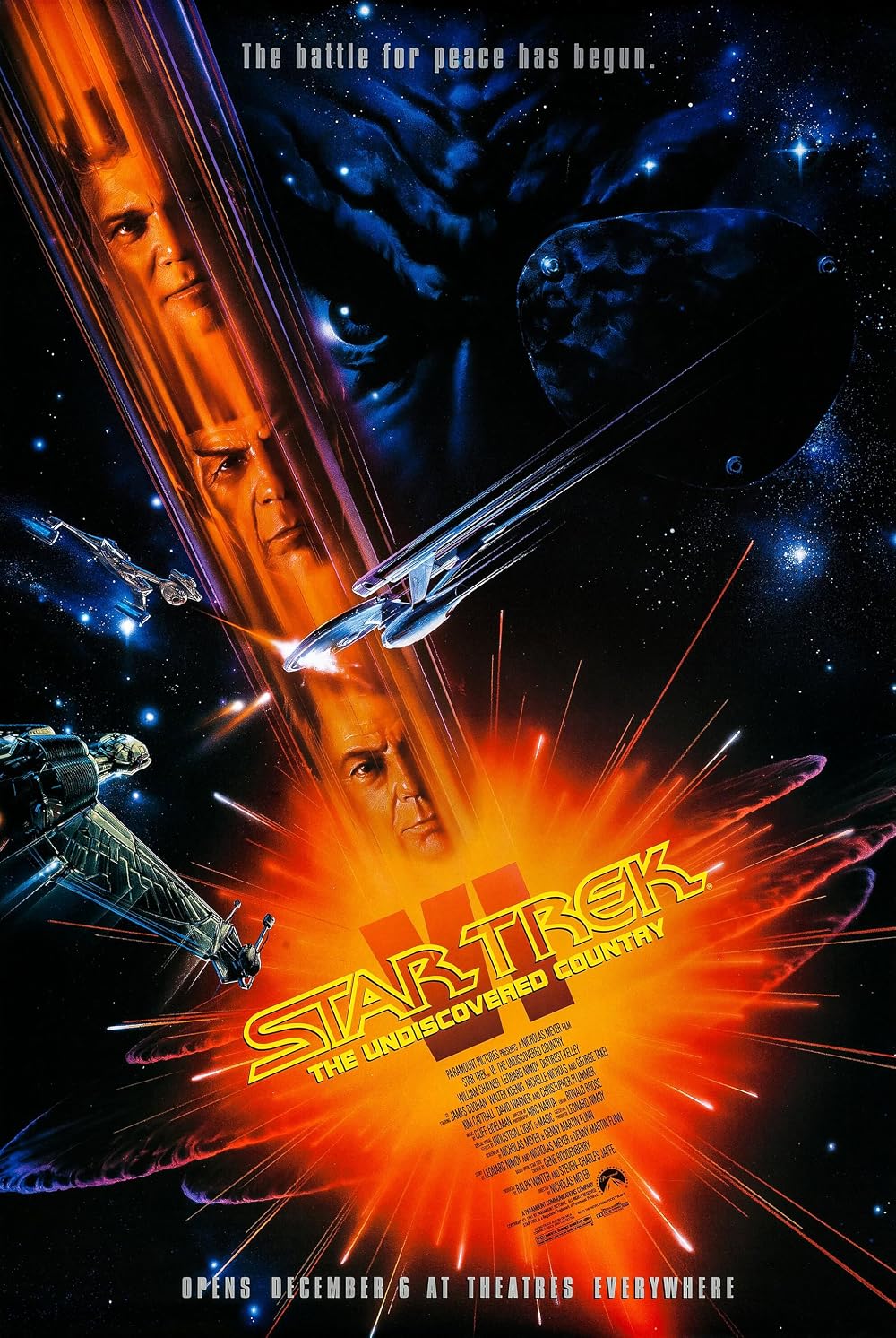 Theatrical poster. "The battle for peace has begun" across the top, the Enterprise streaking diagonally through a starfield with a Klingon face looming behind it, and an orange starburst at the foot behind the logo