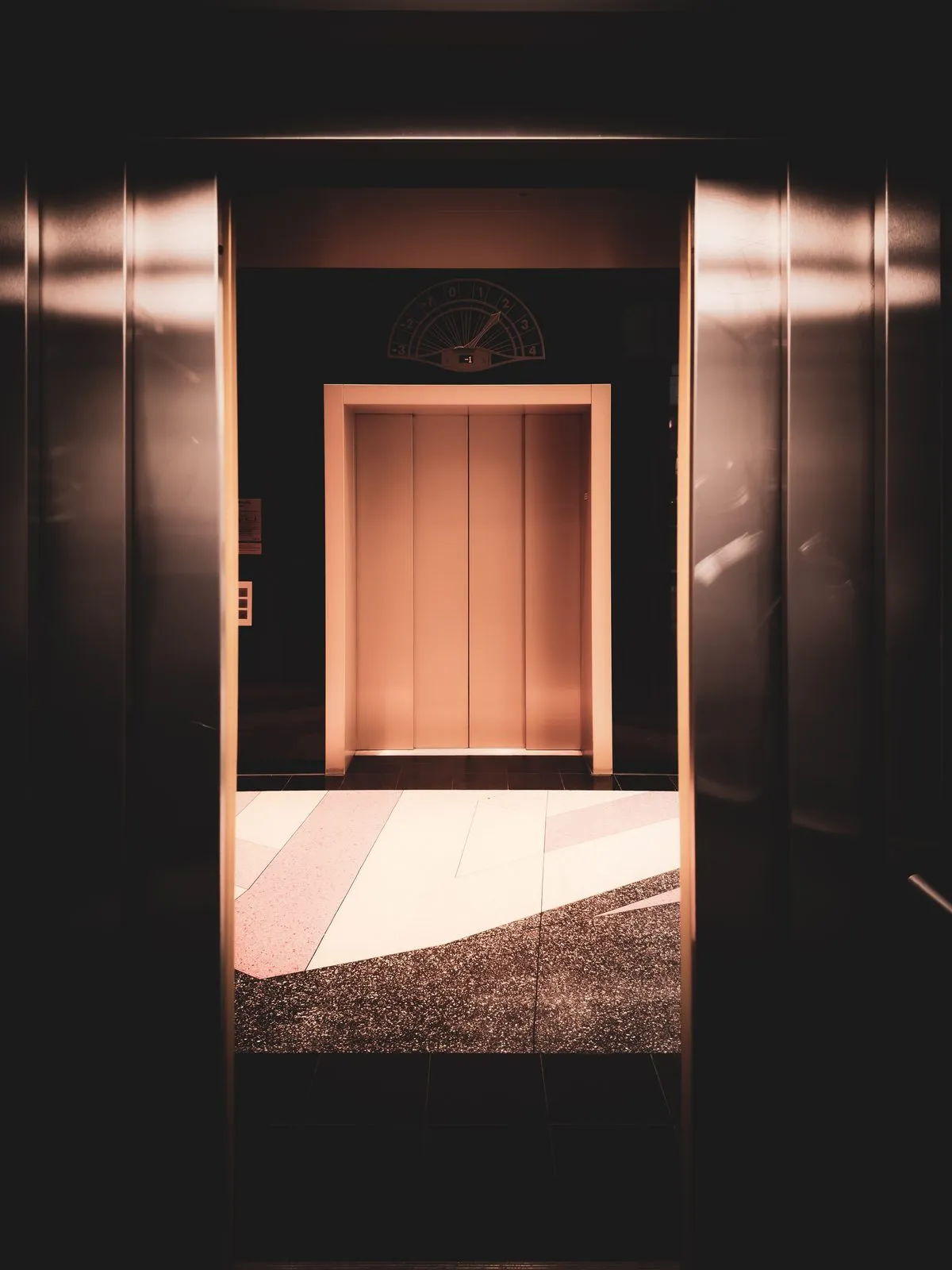 Good manner: an elevator car sits with its doors held open, waiting.