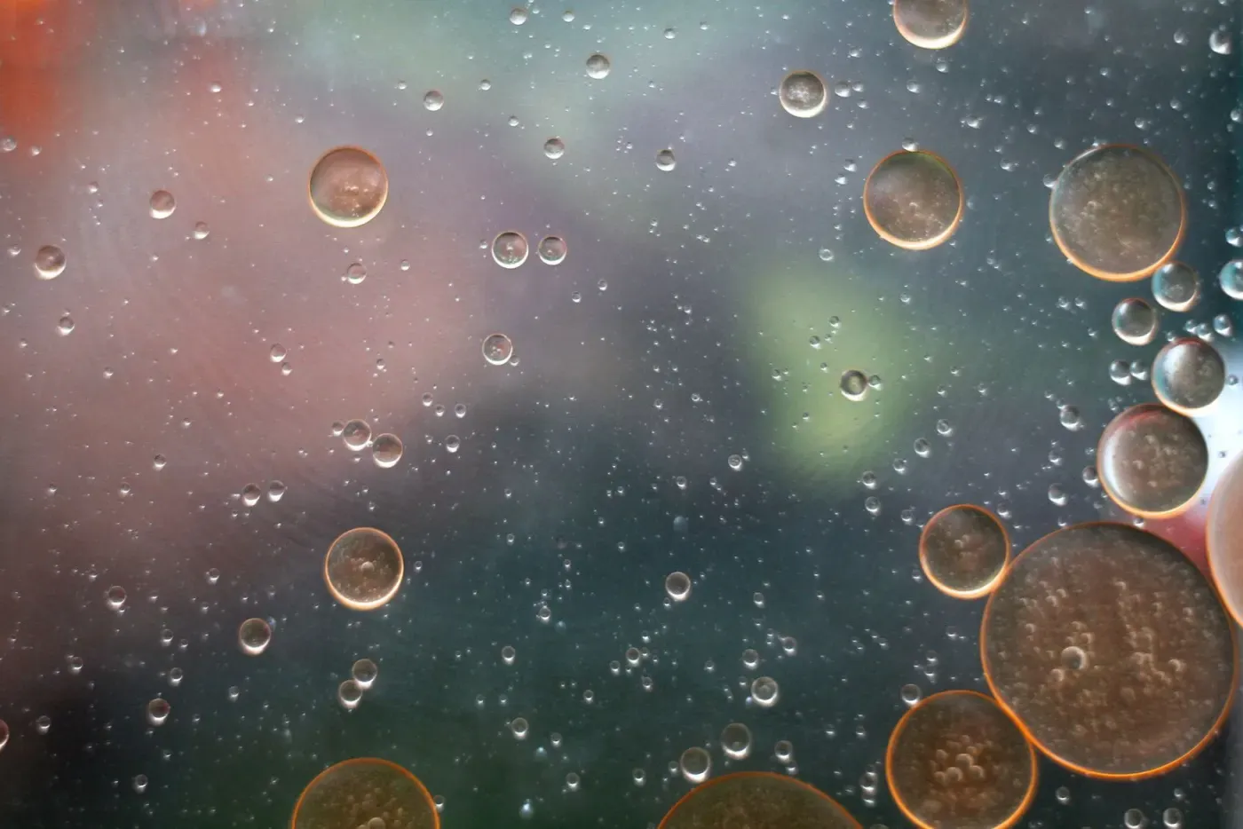 Macro photograph of oil droplets dispersed in water